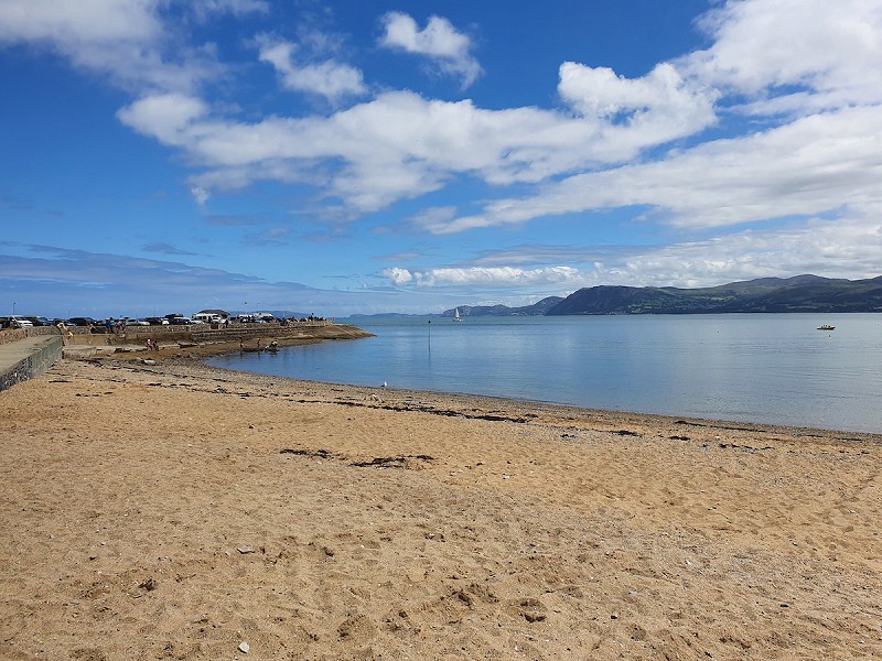 The beach at Beaumaris overlooking Snowdonia
